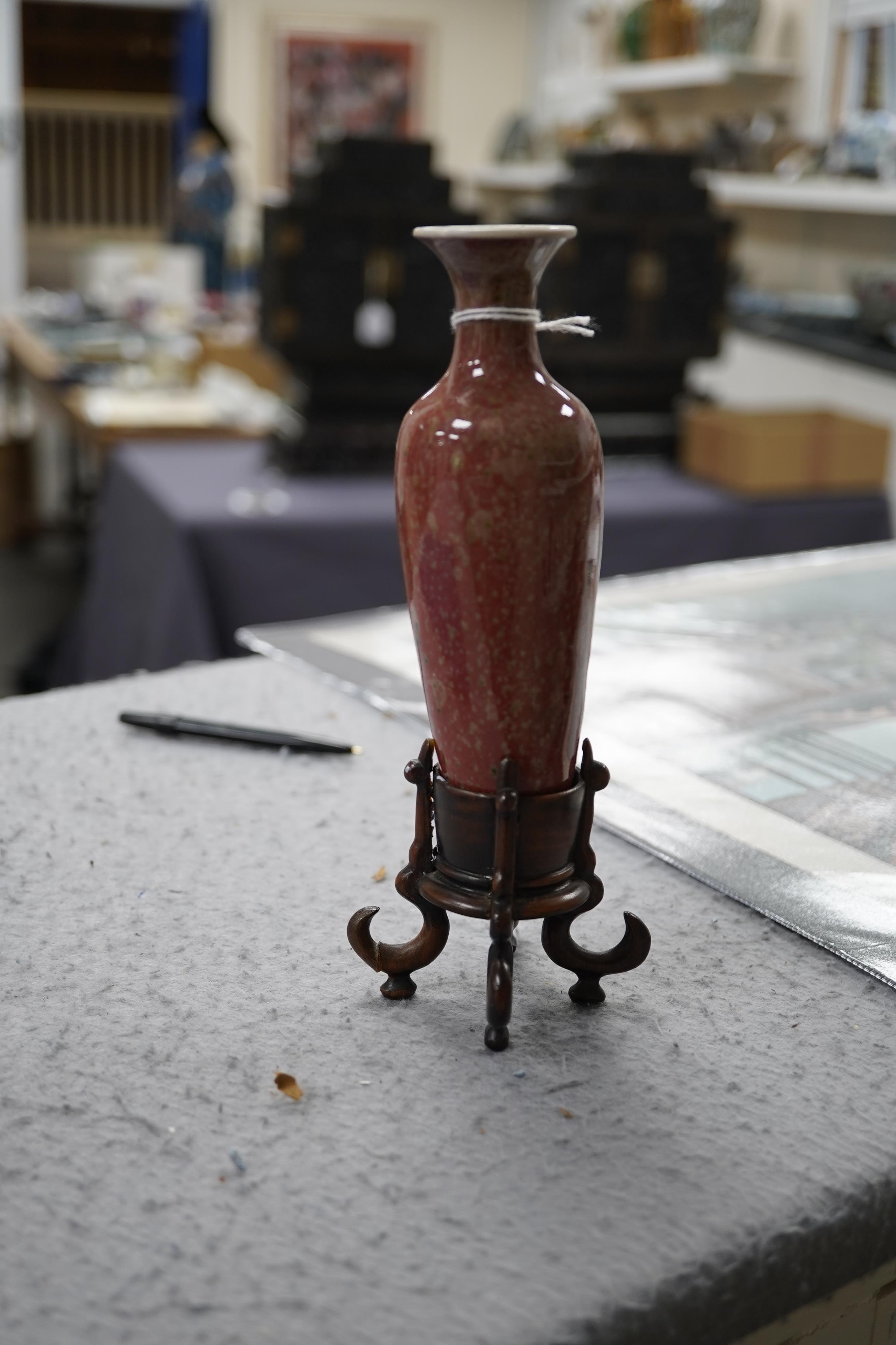 A small Chinese peach bloom glazed vase with fitted wood stand, Republic period